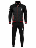 A men's black two-piece tracksuit featuring a zip-up jacket and matching jogger pants. The tracksuit has red piping accents, white embroidered Polo Ralph Lauren logos, a white number 3 on the right sleeve, and red and white striped ribbed cuffs and hem.
