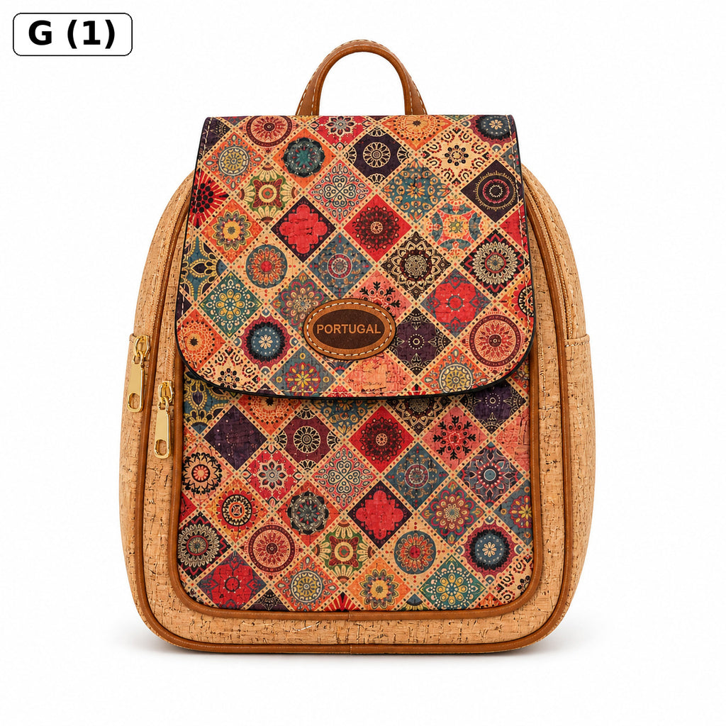 A backpack with a colorful geometric diamond pattern on the front flap and a natural cork border, featuring a top handle and a gold-tone zipper. A small brown leather patch on the front reads 'PORTUGAL'.