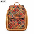 A backpack with a colorful geometric diamond pattern on the front flap and a natural cork border, featuring a top handle and a gold-tone zipper. A small brown leather patch on the front reads 'PORTUGAL'.