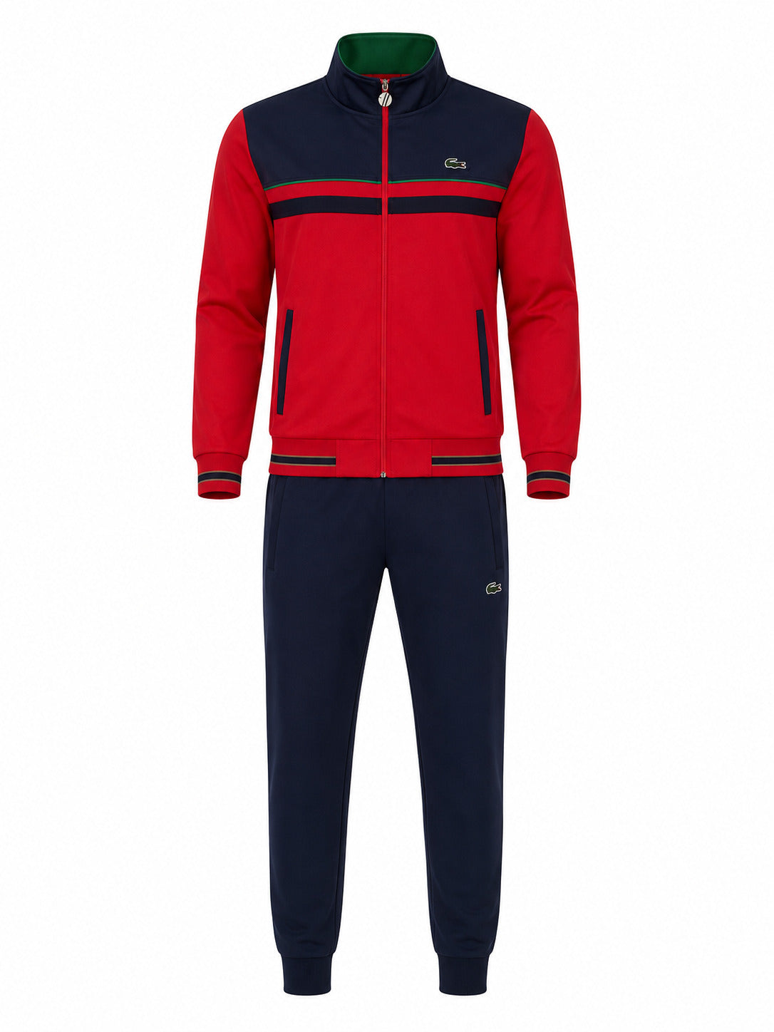 A two-piece Lacoste tracksuit featuring a red and navy blue zip-up jacket with green accents on the collar and cuffs, paired with matching navy blue jogger pants.